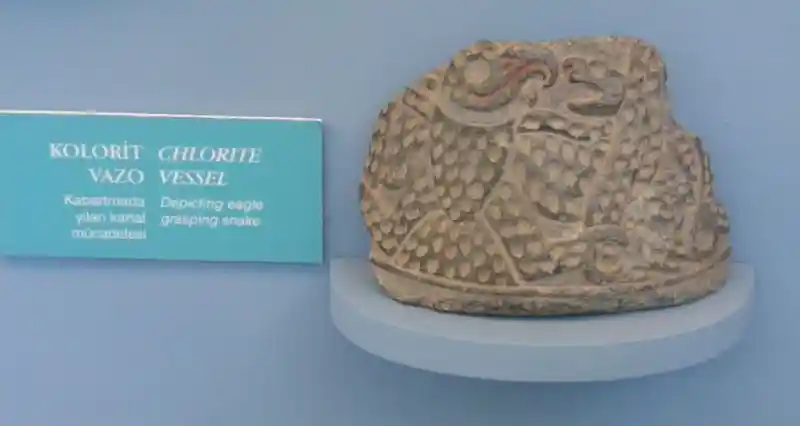 Depicting eagle grasping snake, chlorite vessel